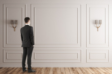 Businessman in white interior