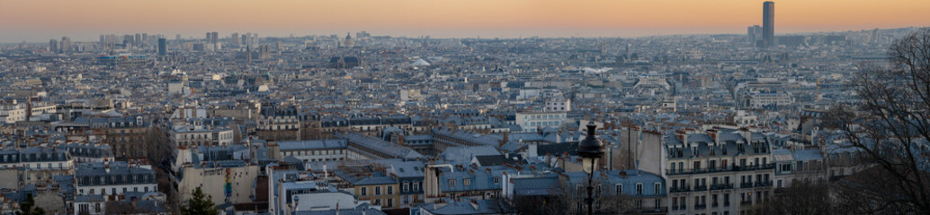 Paris, France - 02 24 2019: Montmartre at sunset. Wonderful panoramic view of Paris from sacred heart