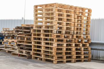 Wooden pallets stacked outside