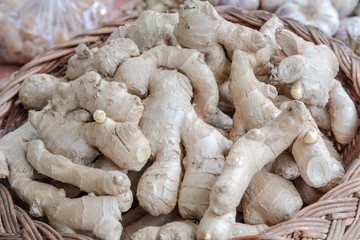 Roote ginger for sale in a brown wicker basket