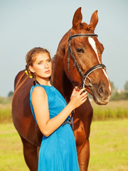  young girl  with  her horse posing together