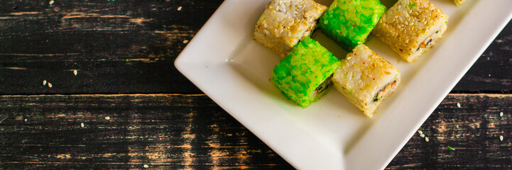 rolls and sushi set mix different tastes. food background. top