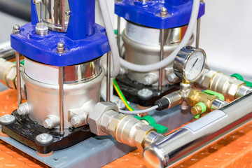 close up vertical pump and valve for high pressure and flow control in industrial work