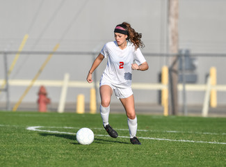 Young soccer player in action © Joe