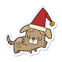 sticker of a cartoon dog in christmas hat