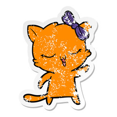 distressed sticker of a cartoon cat with bow on head