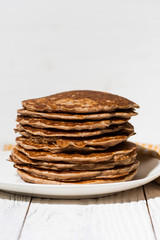 a stack of homemade pancakes, vertical