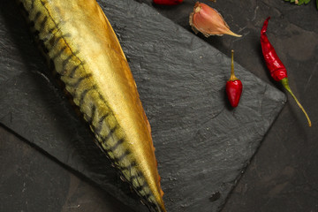 mackerel smoked fish and other ingredients. food background. copy space