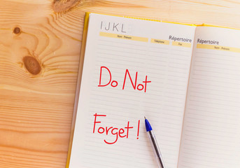 Handwriting text Do Not Forget on notebook