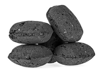 Pile of black charcoal isolated on white background