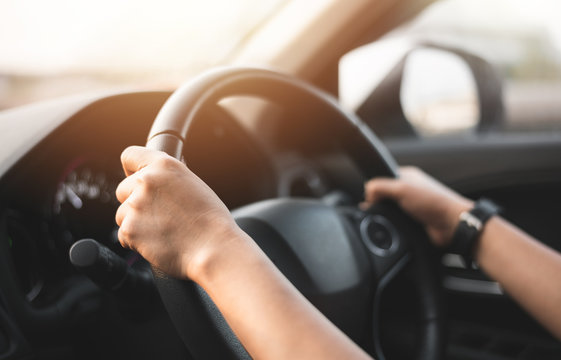 Blurred of Woman Holding Steering Wheel to Driving a Car for  Driver License Test at School - Transportation Concept