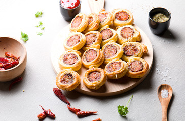 Skewers with sausage and French pastry.