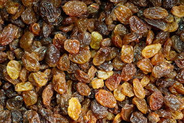 Sultanas washed and dried in close up. Macro background.