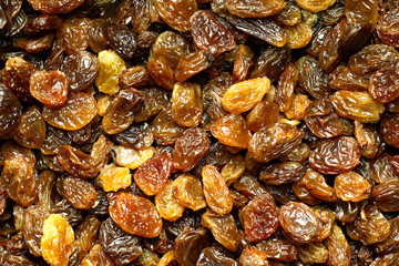 Sultanas washed and dried in close up. Macro background.