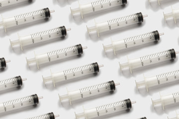 Medical disposable syringe on white background. Pattern for your design