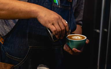 Fototapeta na wymiar barista make coffee latte art
