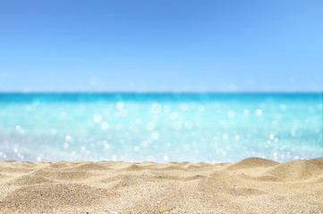 Fototapeta na wymiar beautiful sandy beach with blur ocean background summer concept