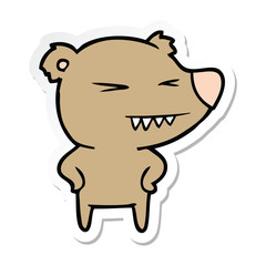 sticker of a angry bear cartoon with hands on hips