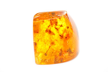 Yellow amber with inclusions and insects on a white background. Sun Stone Scientific object of ancient resin. Material for jewelers. Crystal Natural mineral