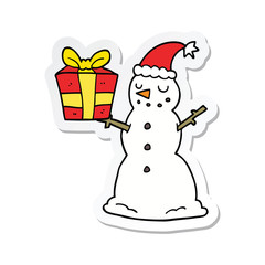 sticker of a cartoon snowman with present