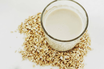 Plant milk. Oat grains milk on white background. Healthy food