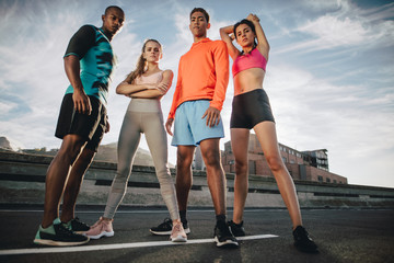 Fitness group standing together after workout © Jacob Lund