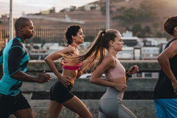 Group of runners training together in morning