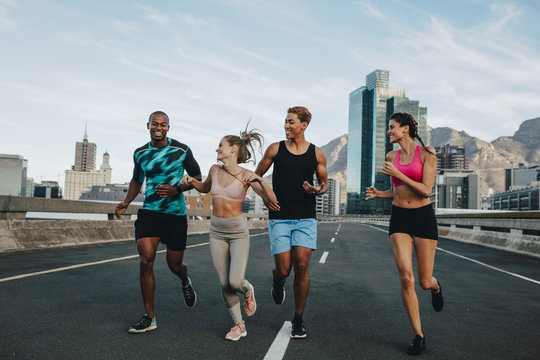 Runners training together outdoors in morning