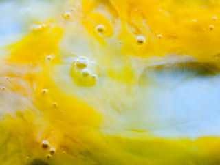 Naklejka na ściany i meble Close up egg yolk macro shot food yellow and white texture liquid bubbles