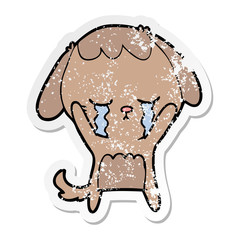 distressed sticker of a cartoon dog crying