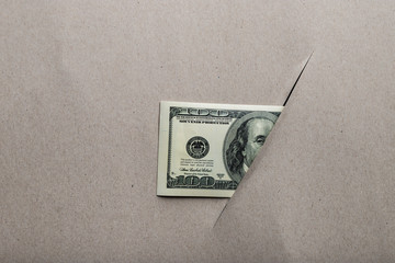 cut sheet of paper and dollar bills