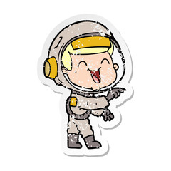 Obraz premium distressed sticker of a happy cartoon astronaut