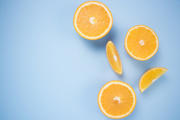 Pieces of citrus on a blue background.