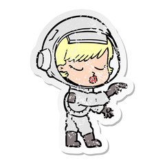 distressed sticker of a cartoon pretty astronaut girl pointing