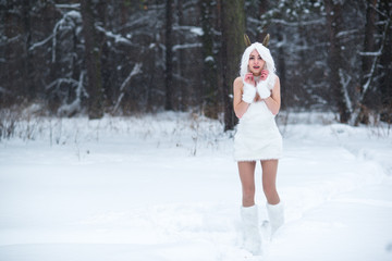Fototapeta na wymiar Cosplay girl in fantasy style in snow in winter