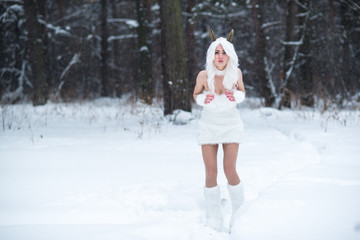 Cosplay girl in fantasy style in snow in winter