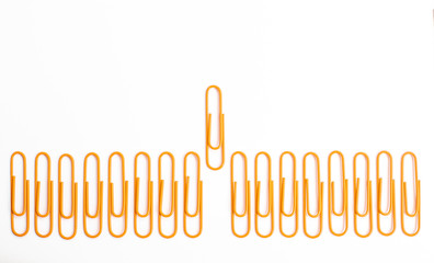 Paper clips isolated one stood out first