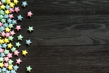 Beautiful background with light multi-colored paper stars