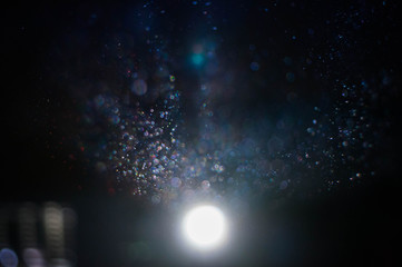 Projector lightning. Miracle circles. Dark room. Abstract background 