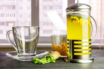 French press filled with fragrant sea buckthorn tea