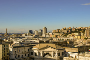 Panoramic aerial view of the entrance of Piazza Principe railway station with harbor, lighthouse (Lanterna) and Matitone skyscraper in the background, Genoa, Liguria, Italy
