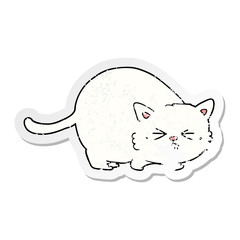 distressed sticker of a cartoon angry cat