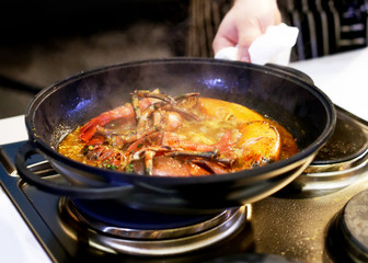 Chef cooking food in the kitchen, Traditional Spanish paella