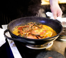 Chef cooking food in the kitchen, Traditional Spanish paella