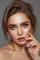 Close-up face of young girl with blue eyes