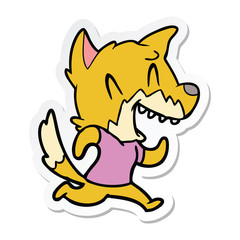 sticker of a laughing fox running away