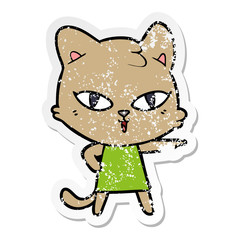 distressed sticker of a cartoon cat in dress pointing