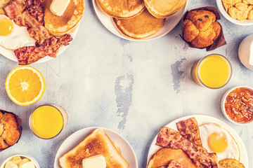 Healthy Full American Breakfast with Eggs Bacon Pancakes and Latkes.