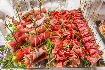 cold buffet  served by different canape, sandwiches, snacks .finger food. meat assorted 
