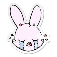 distressed sticker of a cartoon crying bunny face